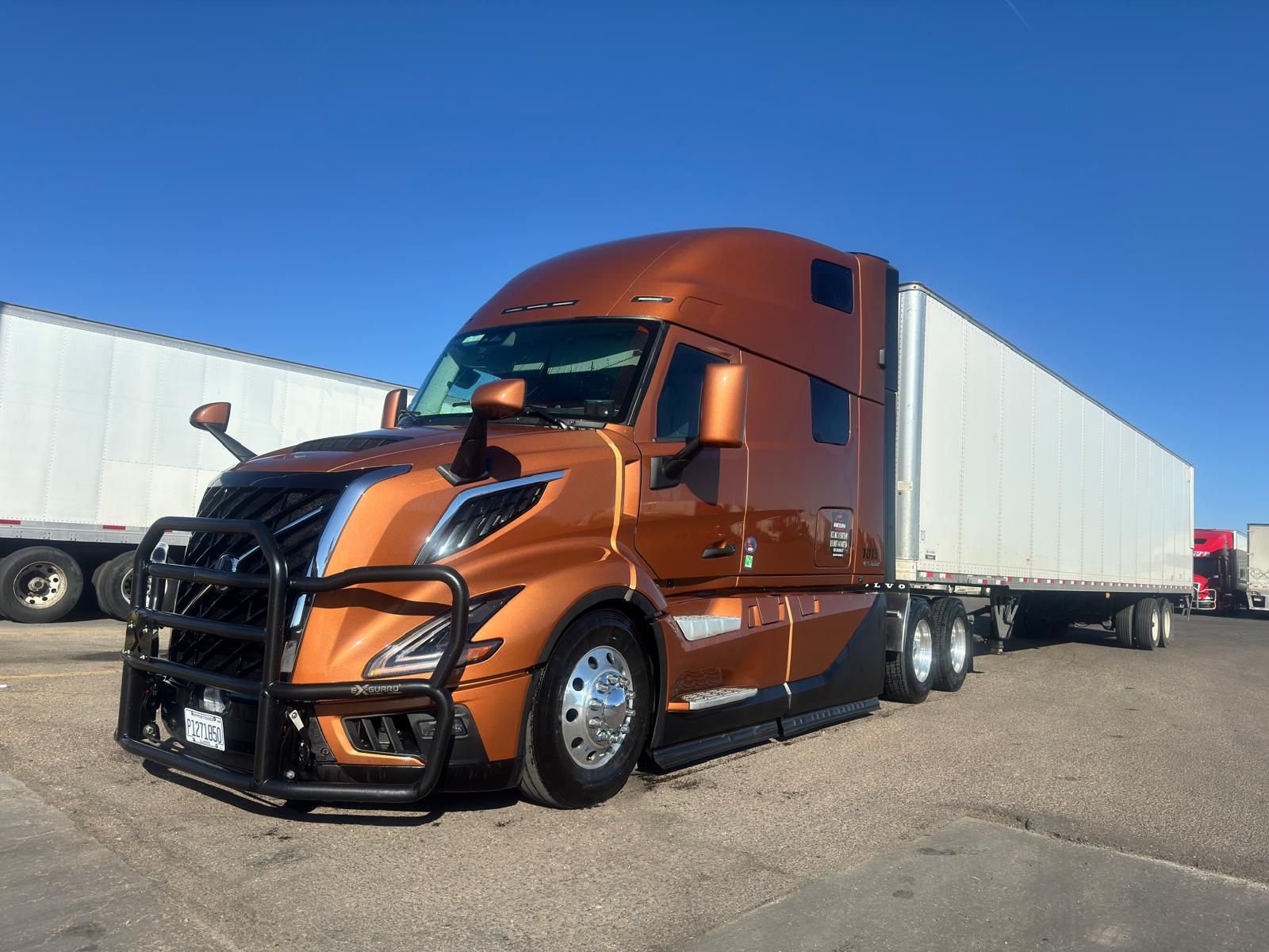 Barcelona Express Volvo VNL860 tractor-trailer parked in a truck yard